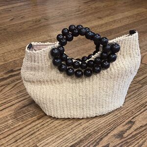 Elegant Cream Woven Handbag with Black Beaded Handle